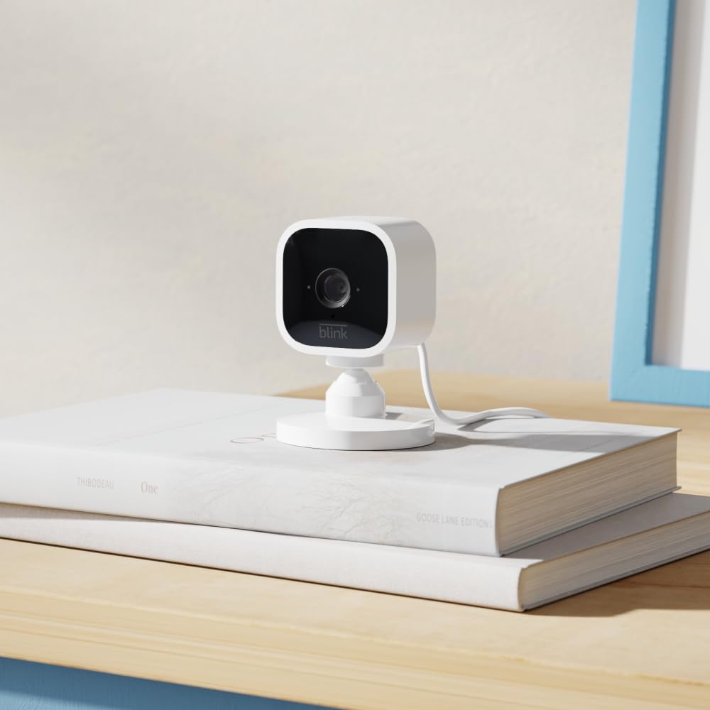 Blink Mini – Compact indoor plug-in smart security camera, 1080p HD video, night vision, motion detection, two-way audio, easy set up, Works with Alexa – 3 cameras (White)